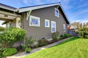 Close-up of a home exterior with a vibrant vinyl siding project, highlighting its smooth texture and modern design.