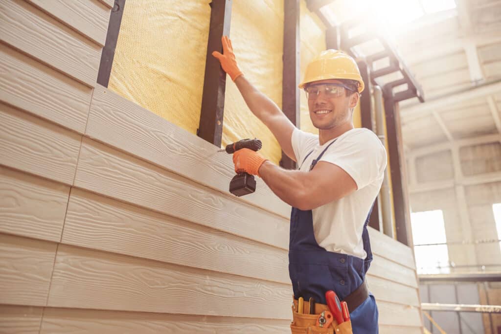 siding contractor install with drill