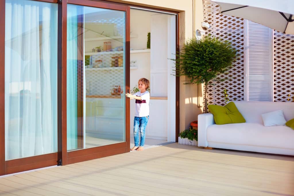 patio doors boy opening sliding glass